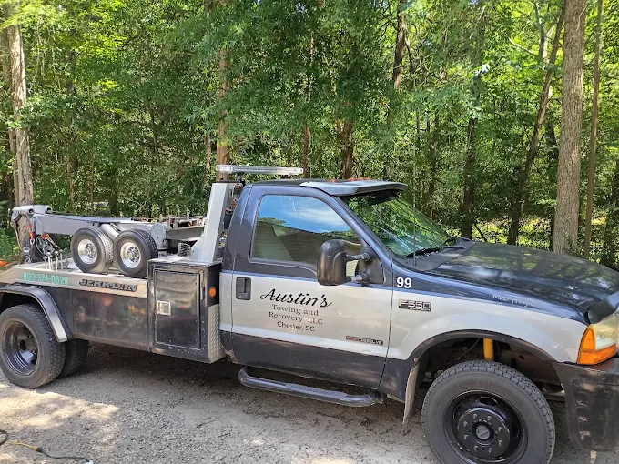 Austin's real tow truck parked among trees